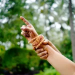 Couple performing a South Indian ritual on their wedding day, captured by sidphoto.